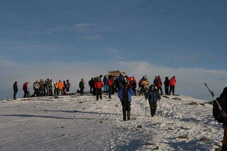 Trust Tours guides and climbers on the trail up Kilimanjaro