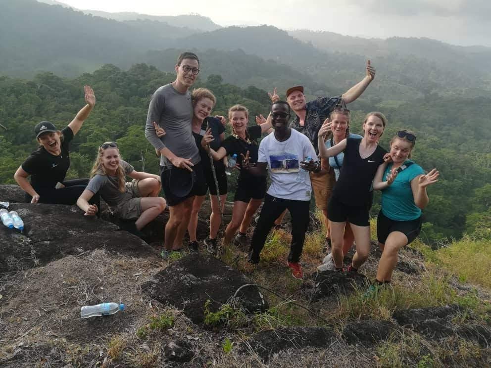 The Trust Tours crew celebrating with a group of climbers